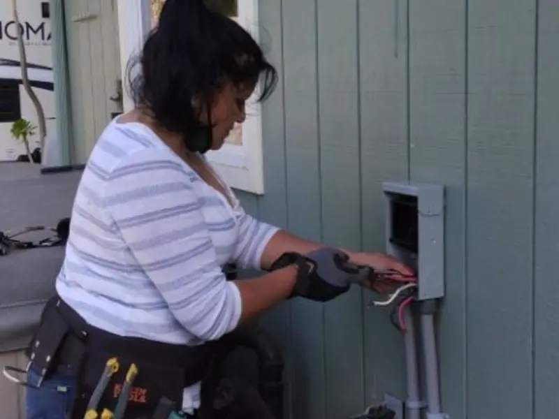 Licensed electrician wiring an exterior subpanel in South St. Paul